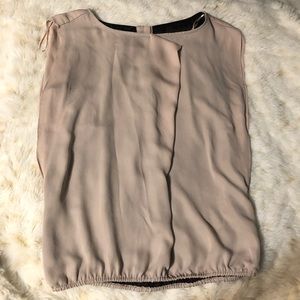 Really cute blush and black blouse!